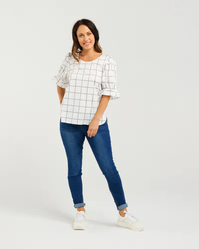 Model wearing White Grid Sadie Top By Seduce Available at Beetees Nelson